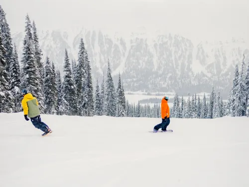 Snowboarders main face of Powder King above resort