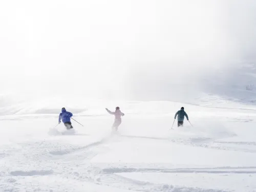 Skiers and snowboarders enjoy a Banff Sunshine Village powder day