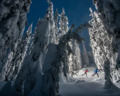 cross-country skiers at night at SilverStar