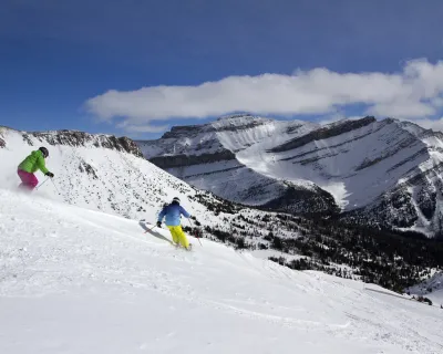 Two skiers at Lake Louise Ski Resort, Alberta