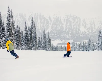 Snowboarders main face of Powder King above resort