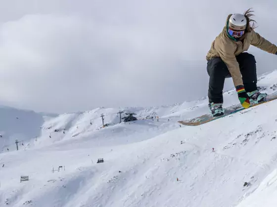 Snowboarder taking air at Marmot Basin in Jasper, AB, Canada