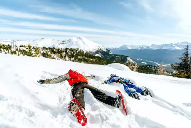 Making Snow Angels at the top of Lake Louise Ski Resort.