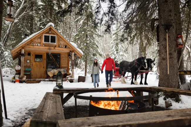 Smithers BC sleigh ridge couple fire cabin