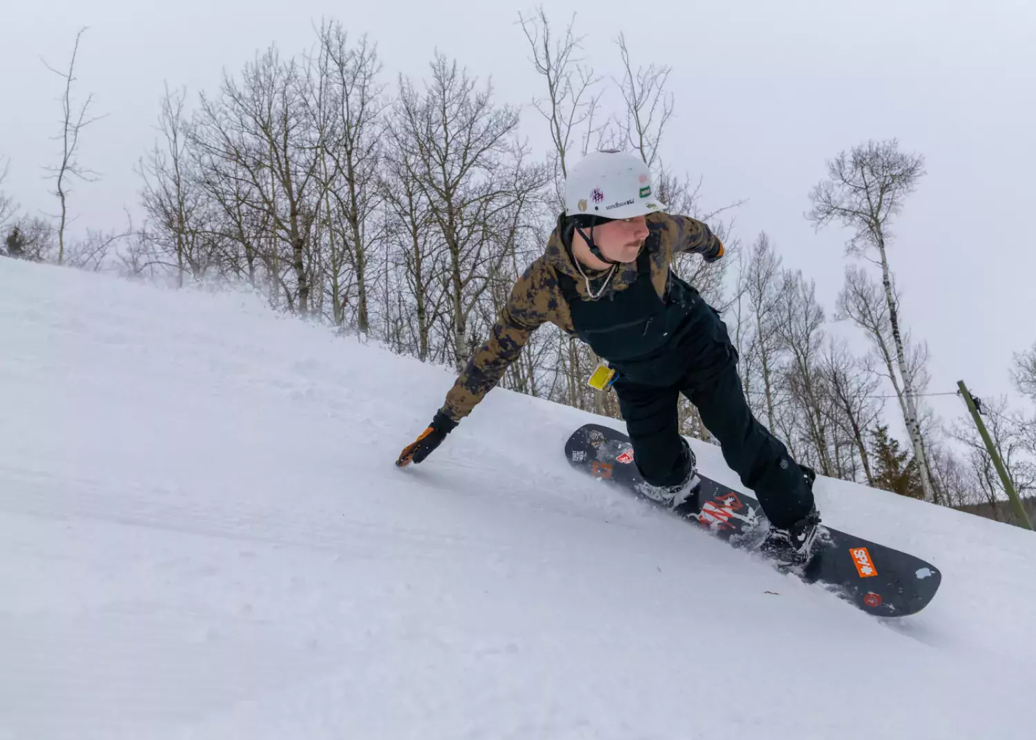 A snowboarder laying big carves at Nitehawk. / Paul Lavoie snowboard Nitehawk Year-Round Adventure Park Grande Prairie AB Paul Lavoie