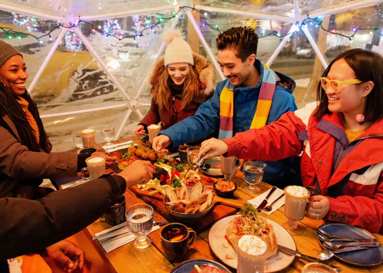 Friends enjoying a meal in one of the heated #YEGWinterPatios