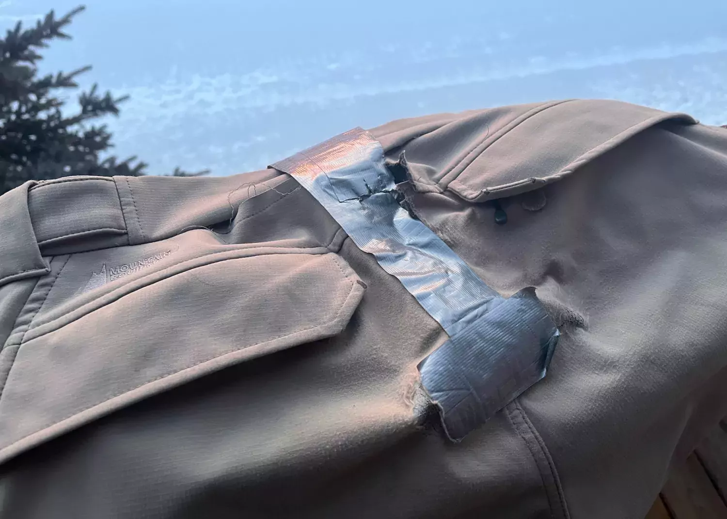 Out with the old... Old snow gear with duct-taped repairs