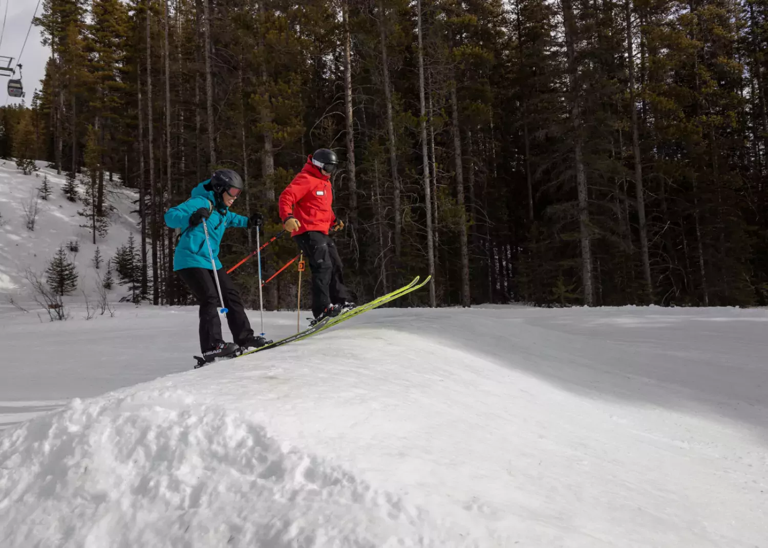 Armstrong gives Bels tips on how to approach the run-in. / Paul Lavoie skiing terrain park jump Lake Louise AB