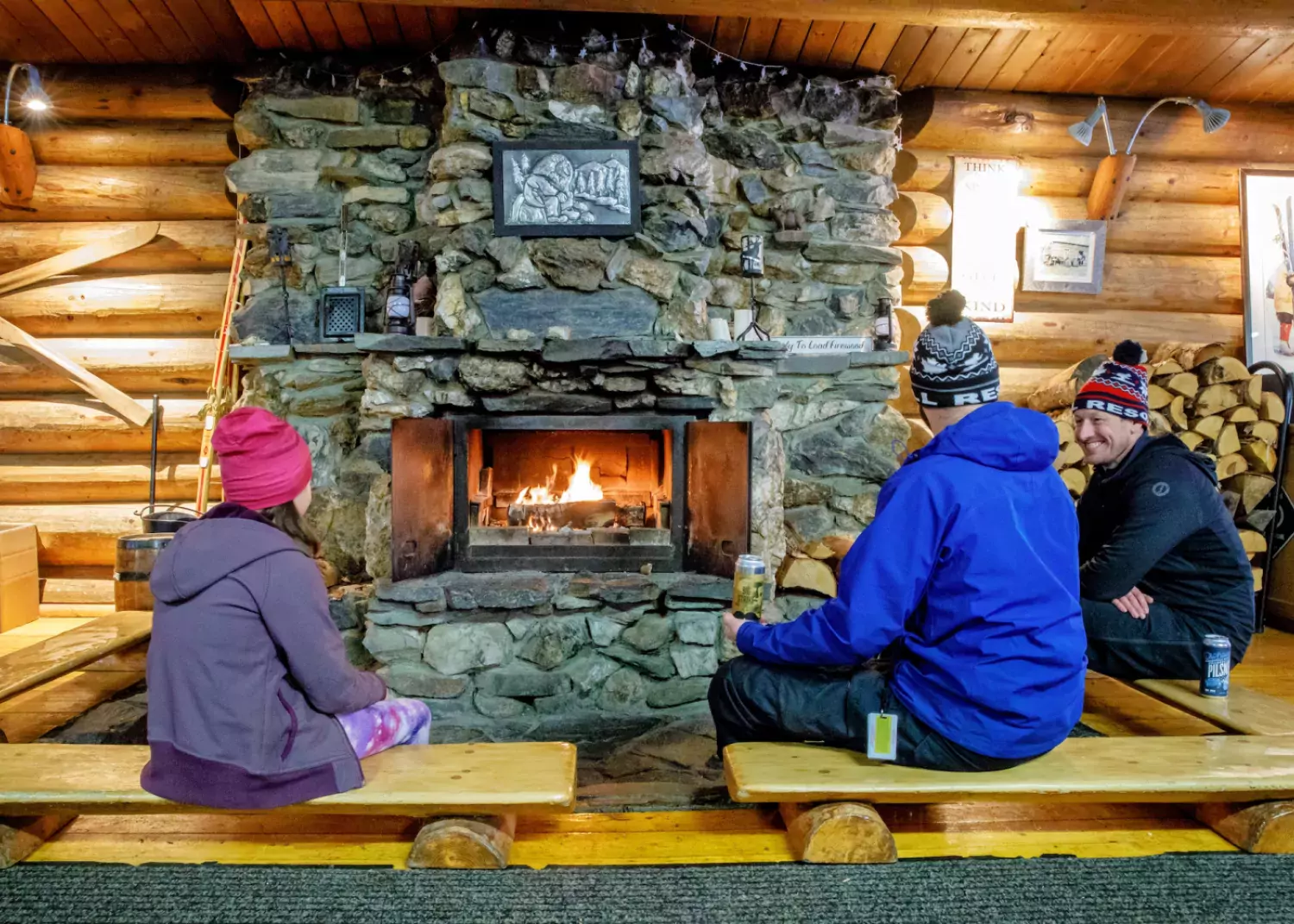 Friends are made quickly around the hearth inside the main lodge. / Bonnie Grenon Troll Ski Resort BC
